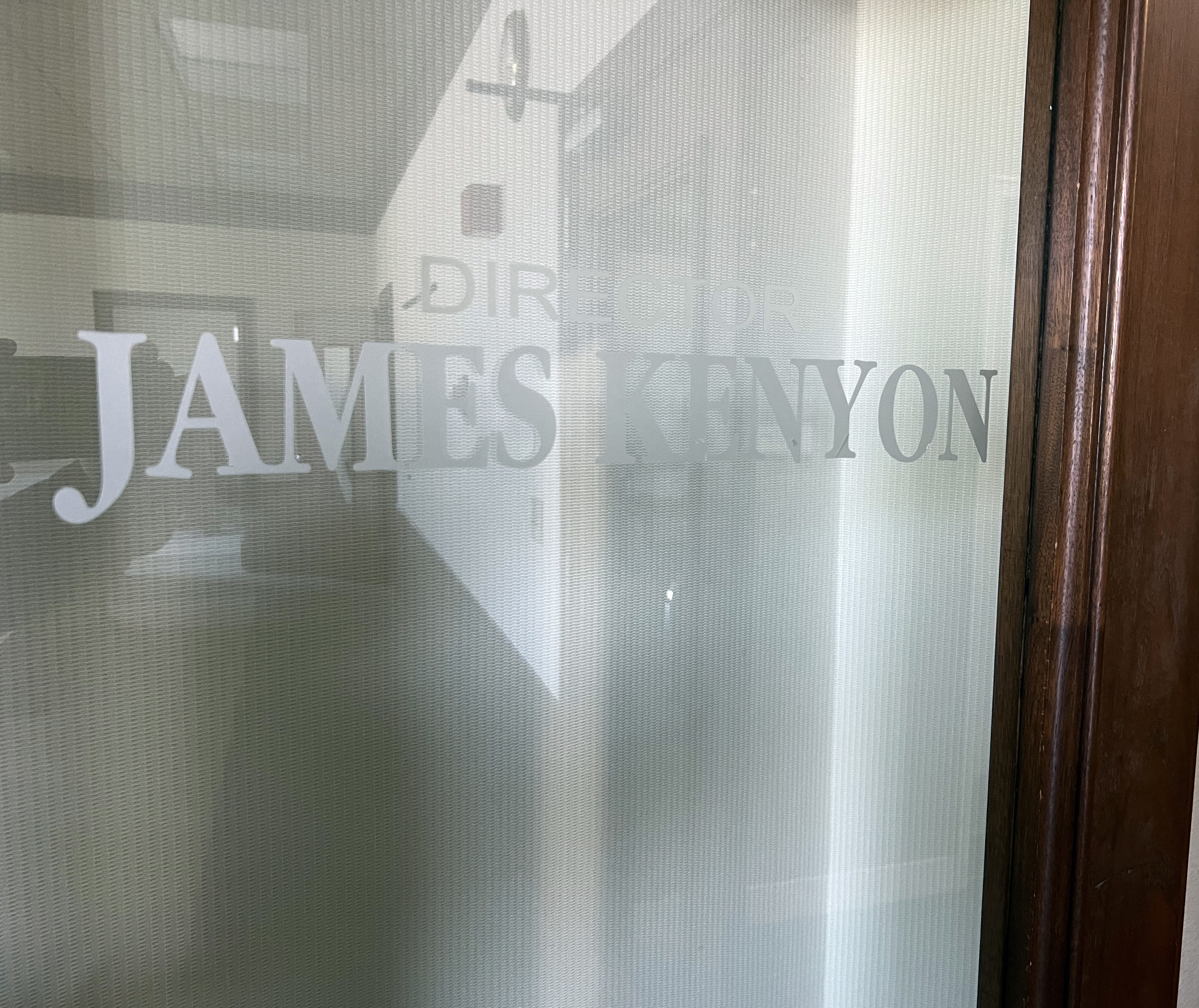 Glass door with Jimmy Kenyon etched.