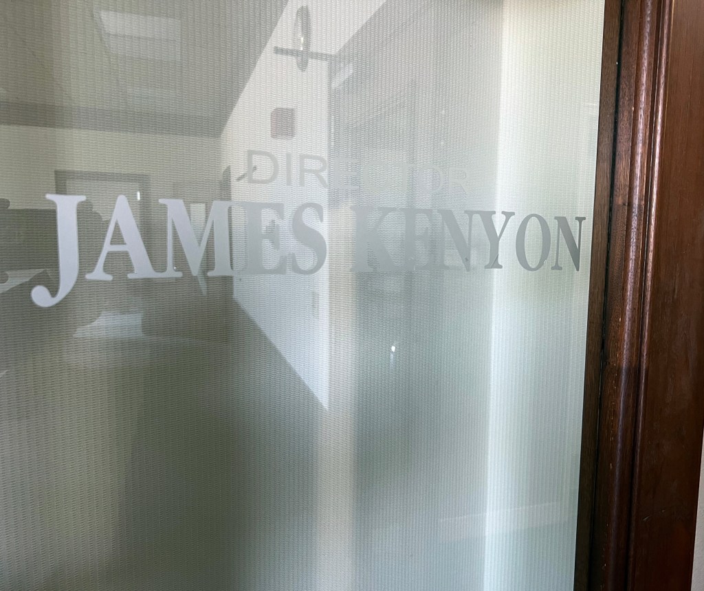 Glass door with Jimmy Kenyon etched.
