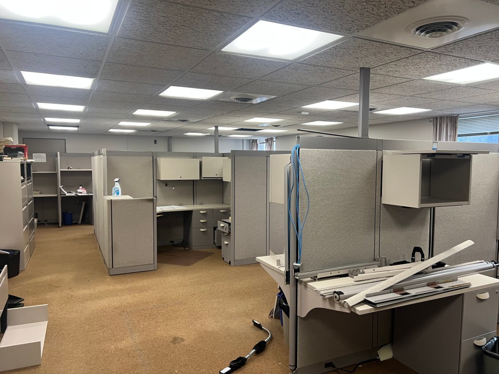 Large room with cubicles.