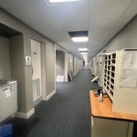 View down long basement hallway.