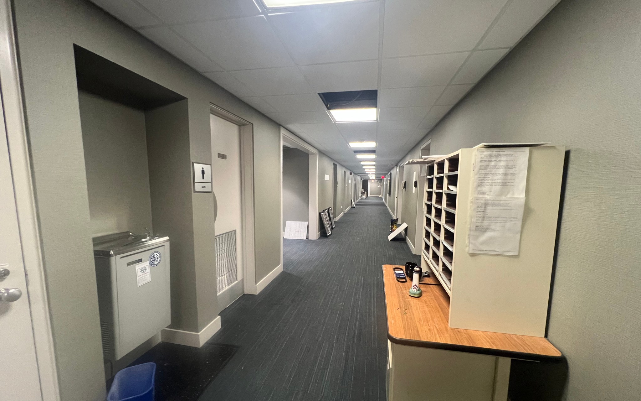 View down long basement hallway.