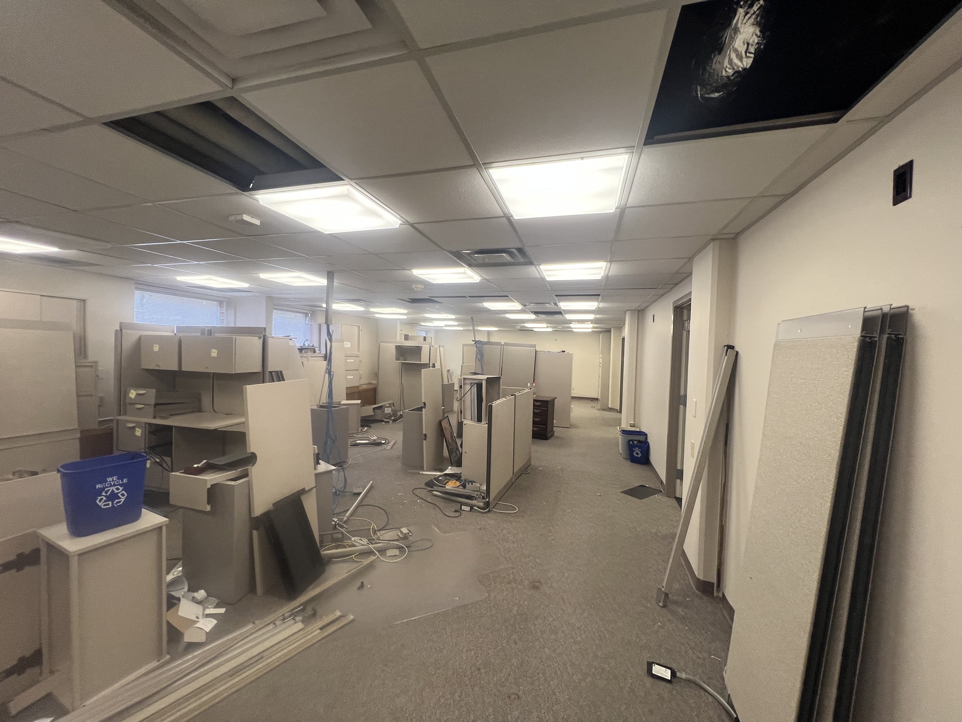 Large empty office with cubicles.