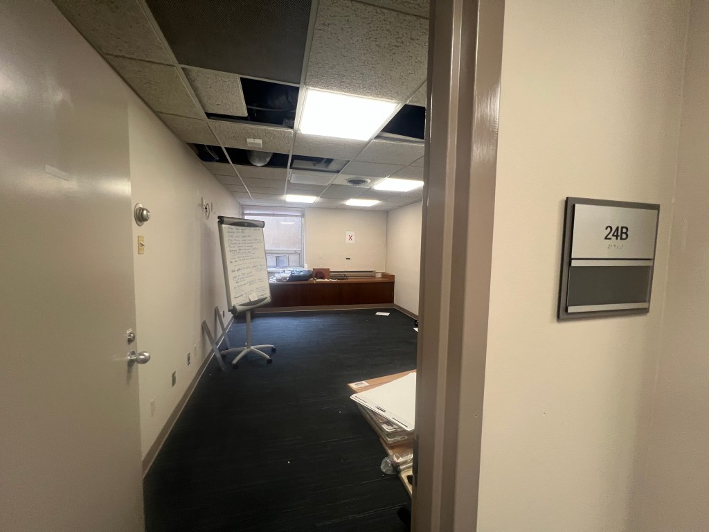 View through door into empty office.