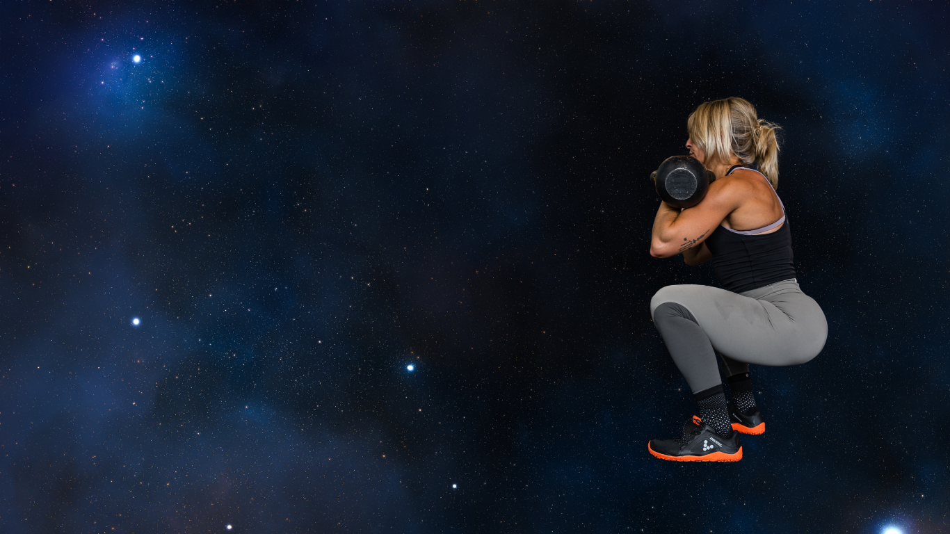 Starport personal trainer, Angela Tino, demonstrates a kettlebell squat.