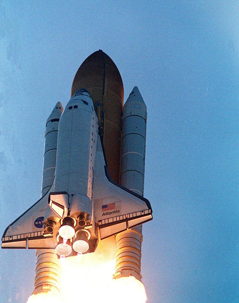 Space shuttle Atlantis roaring into the sky
