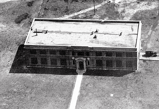 Aerial photograph of two-story building.