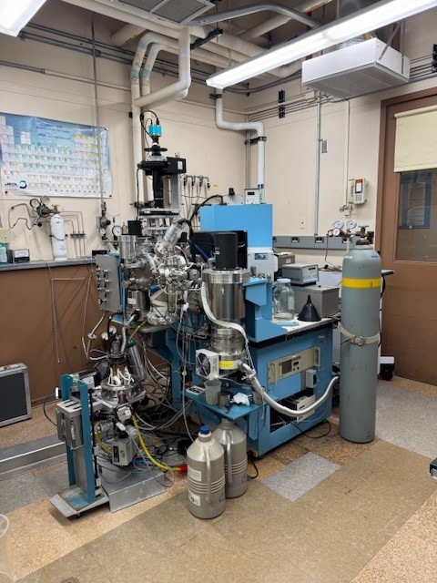 A large metallic and blue painted laboratory instrument.