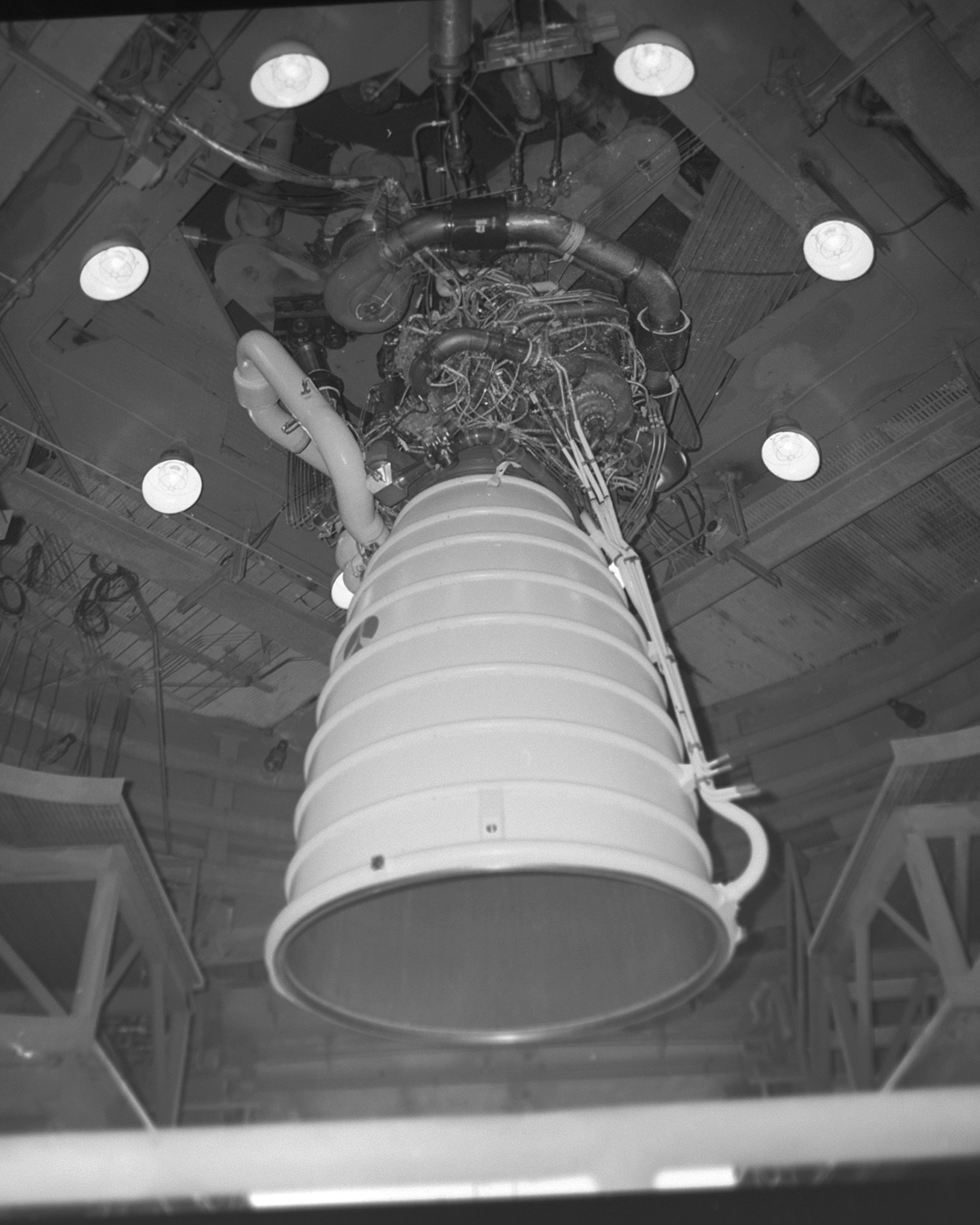 the first space shuttle main engine is shown in black and white installed at the Fred Haise Test Stand