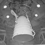 the first space shuttle main engine is shown in black and white installed at the Fred Haise Test Stand