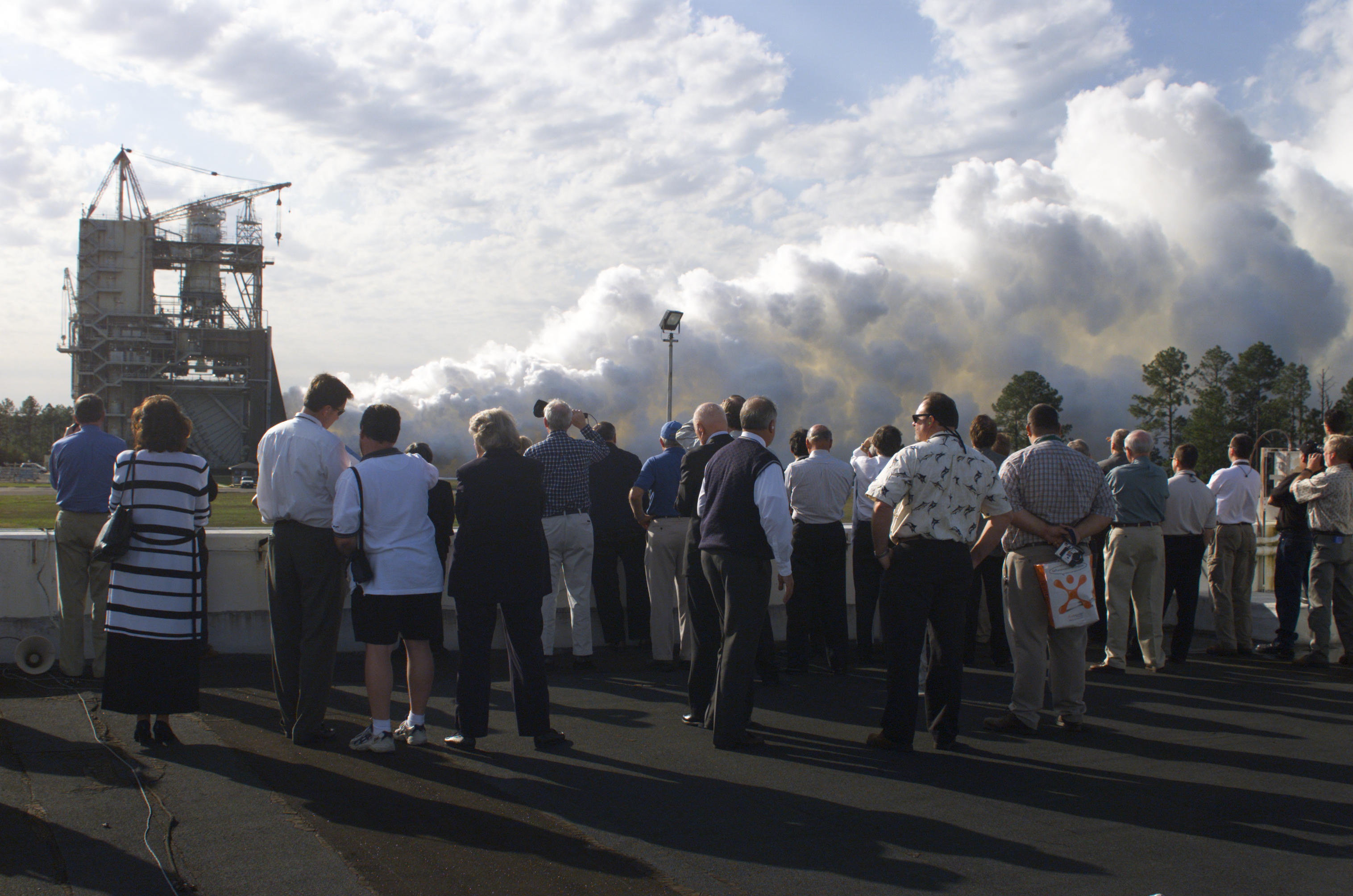 Members of the NASA Advisory Council gather for a viewing a space shuttle main engine test