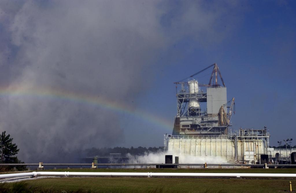A rainbow shines in an evaporating steam plume