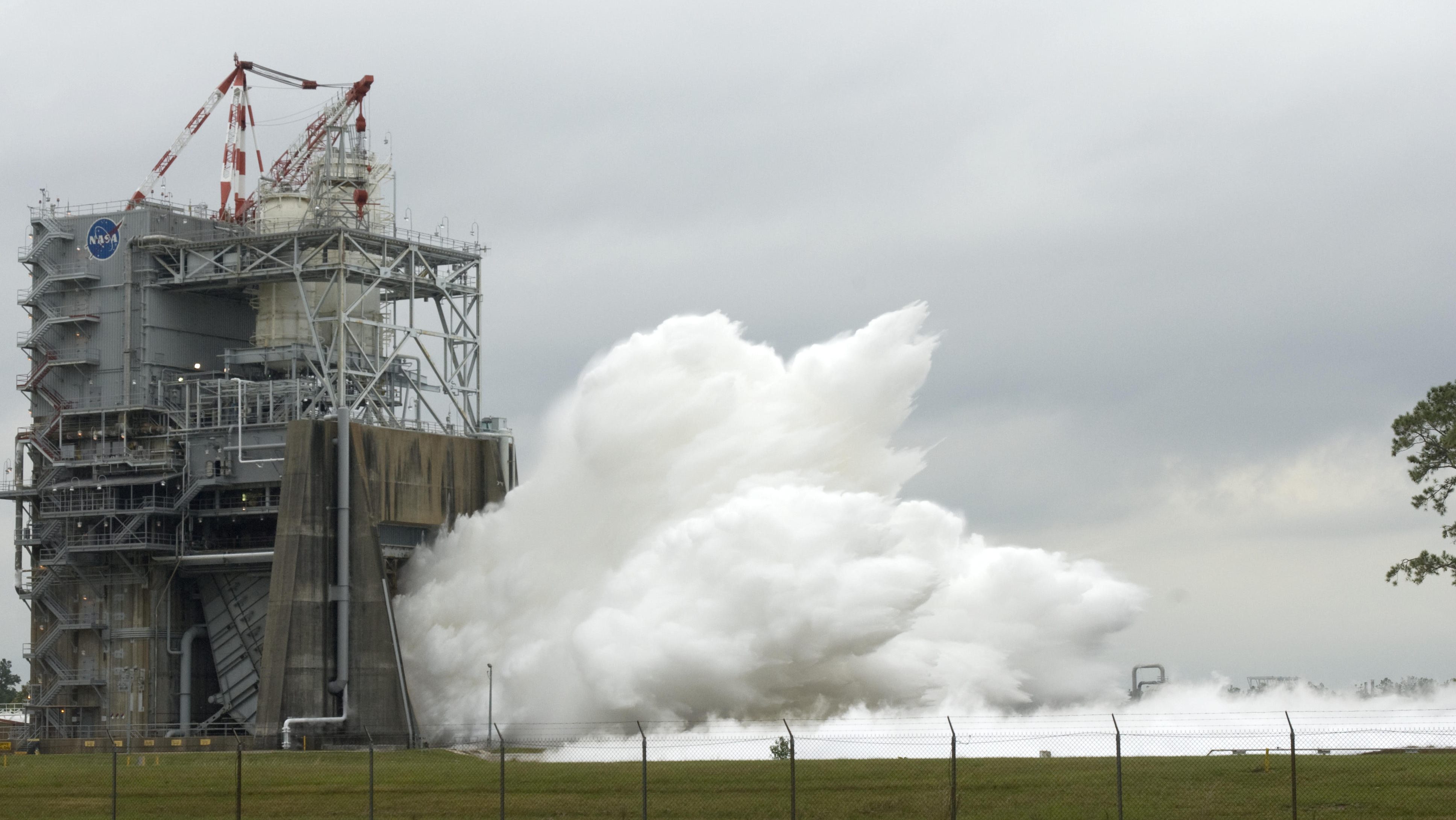 space shuttle flight engine No. 2061 sends vapor into the sky during test