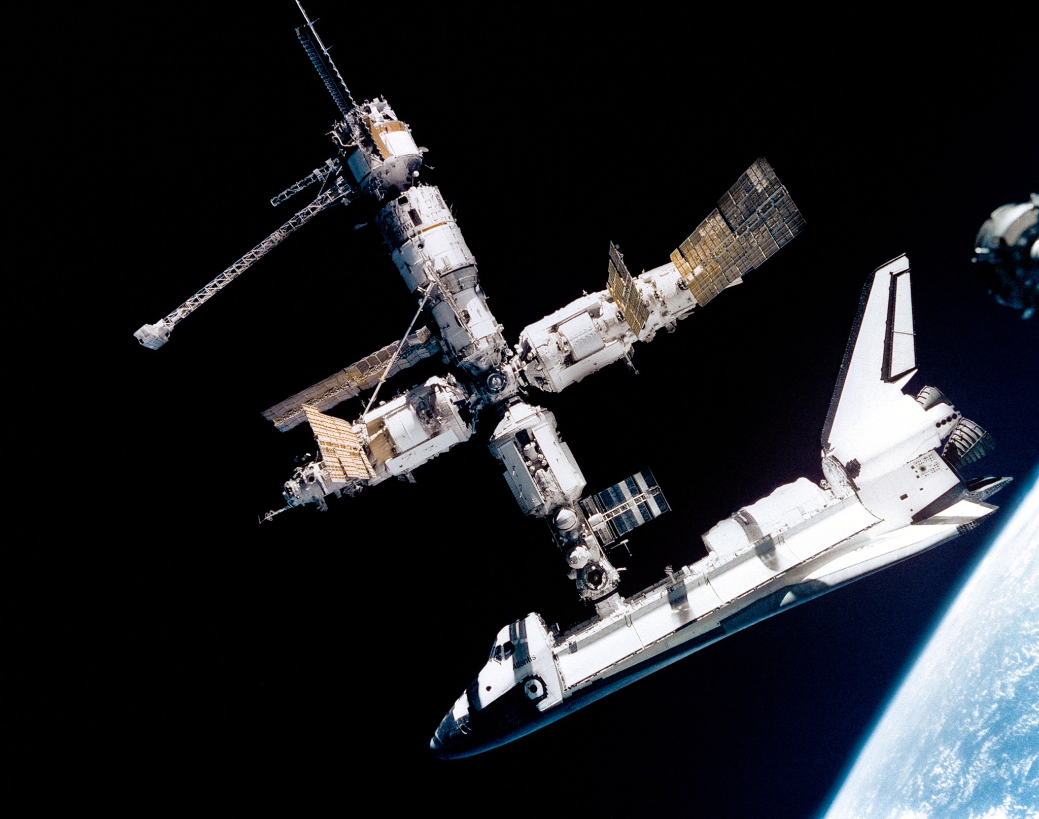 This view of the space shuttle Atlantis still connected to Russia's Mir Space Station was photographed by the Mir-19 crew on July 4, 1995