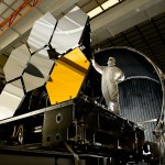 Ball Aerospace lead optical test engineer Dave Chaney inspects six primary mirror segments, critical elements of NASA's James Webb Space Telescope, prior to cryogenic testing in the X-ray & Cryogenic Facility at NASA's Marshall Space Flight Center in Huntsville, Ala. The James Webb Space Telescope will be launched in 2014 to study the formation of the first stars and galaxies and shed new light on the evolution of the universe.