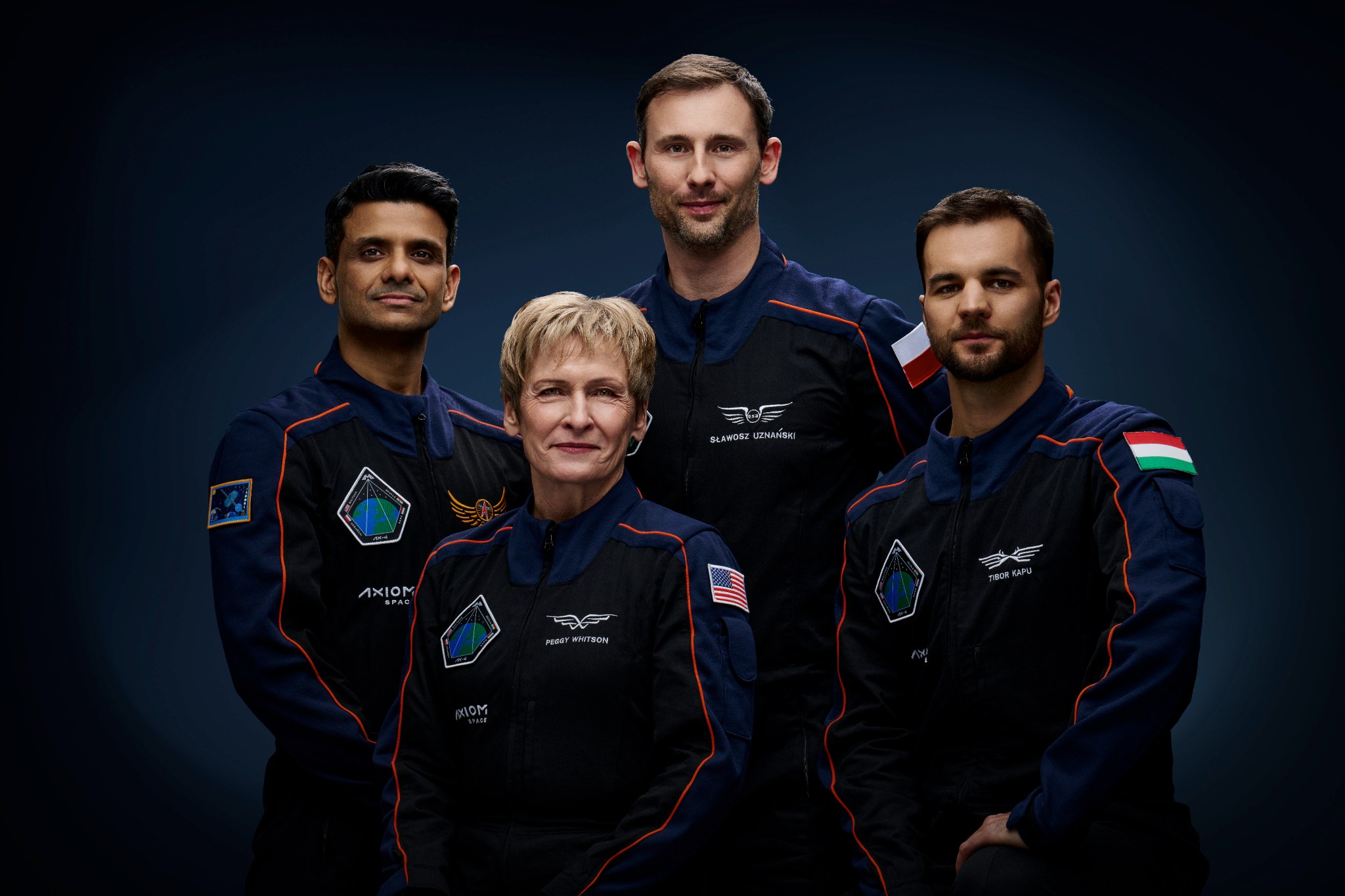 The official crew portrait of the Axiom Mission-4 private astronaut mission to the International Space Station. From left are, Pilot Shubhanshu Shukla from India, Commander Peggy Whitson from the U.S., and Mission Specialists Sławosz Uzanański-Wiśniewksi from Poland and Tibor Kapu from Hungary.
