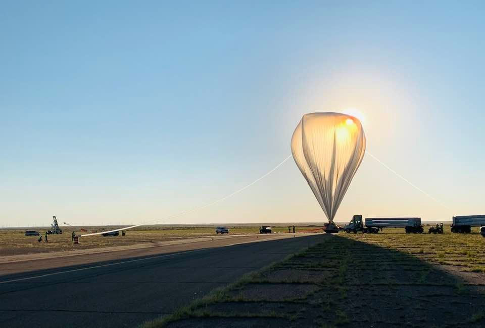 Inflated balloon lit by the sun from behind.
