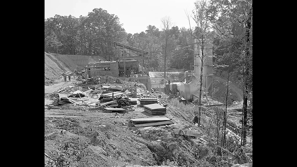 RETF construction site with supplies on ground.