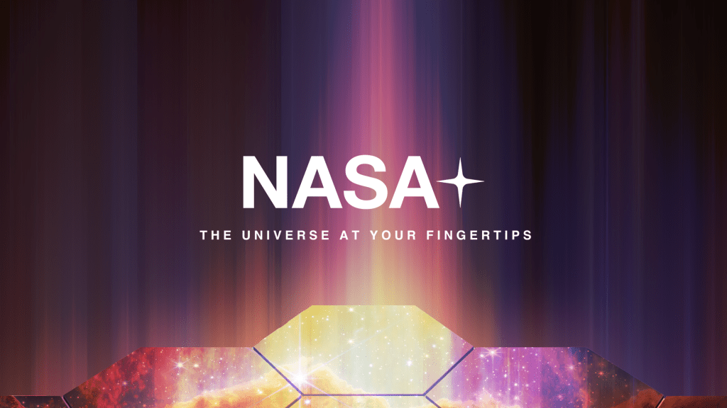 Artist's illustration with the words "NASA+ The universe at your fingertips" above the the James Webb Space Telescope's primary mirror with stars and a galaxy overlayed on it.
