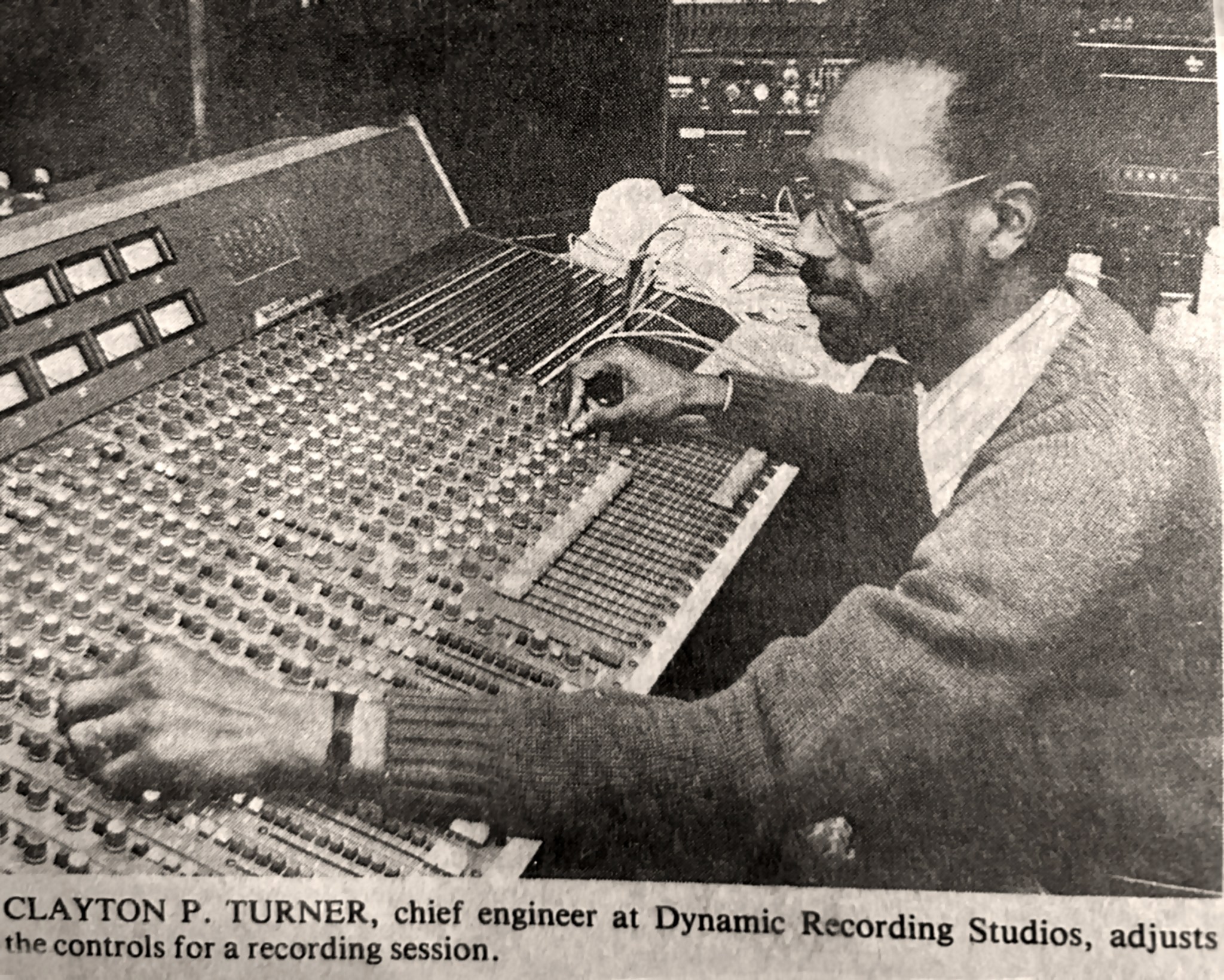Chief recording engineer working the controls for a recording session.