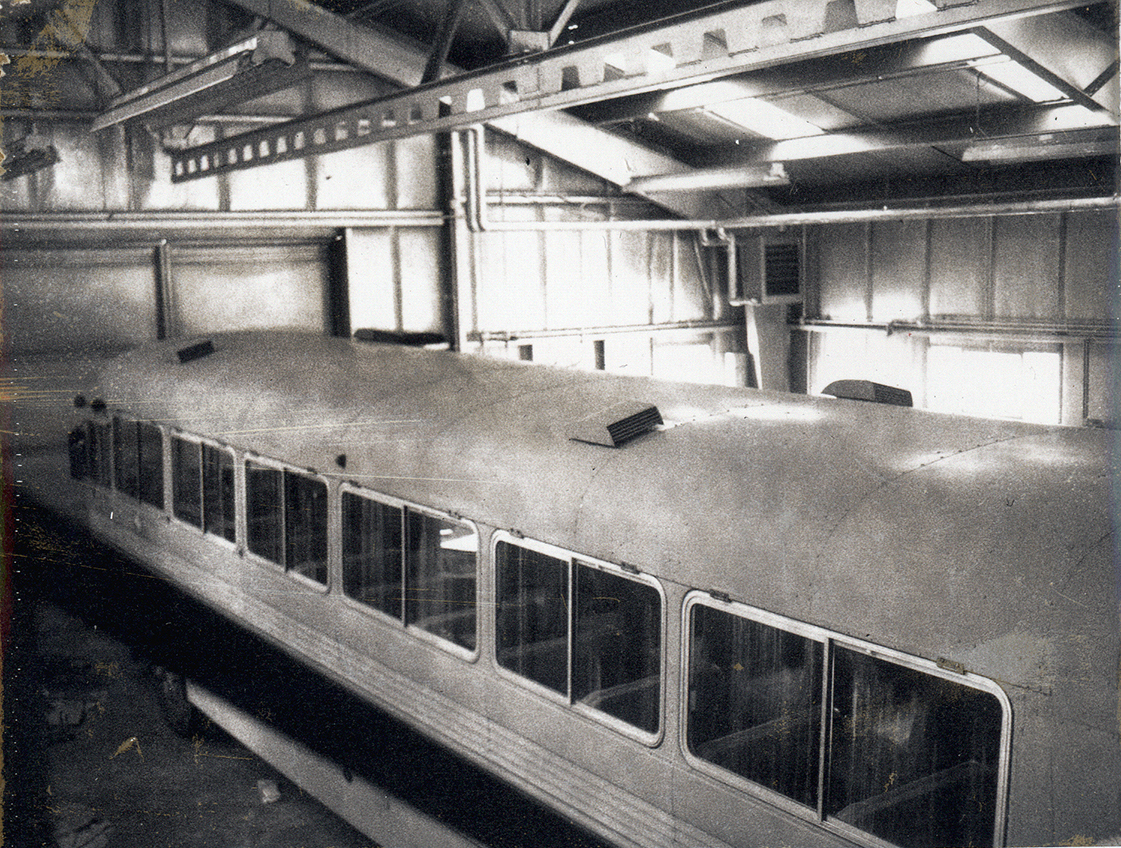 Railroad car inside building.