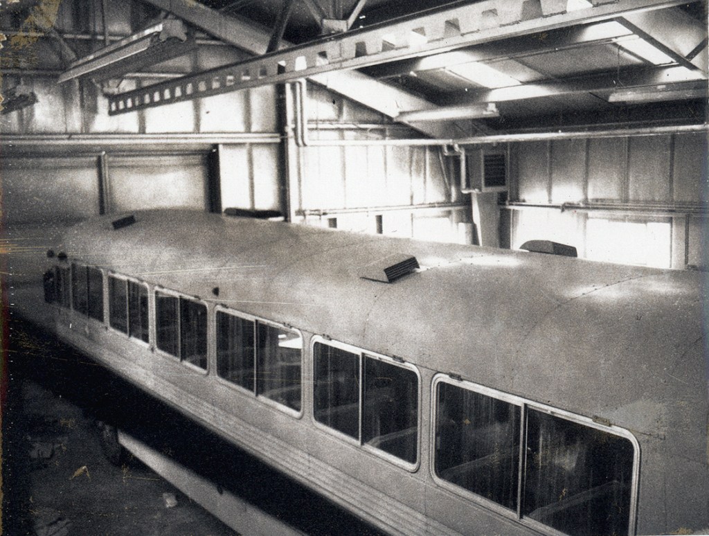 Railroad car inside building.