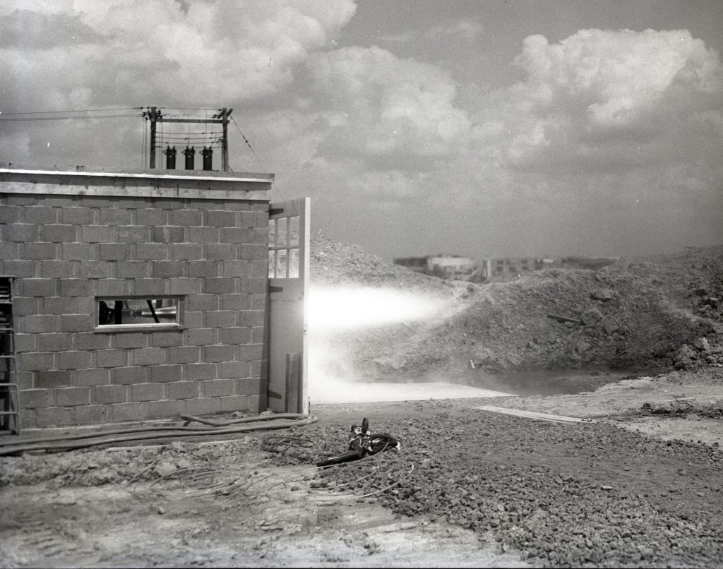 Rocket firing horizontally from test cell.