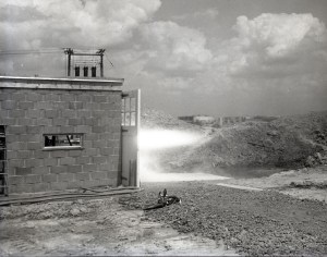 Rocket firing horizontally from test cell.