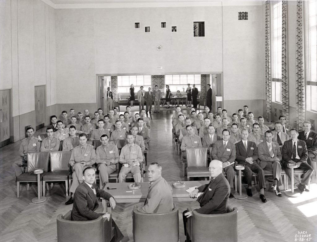 Group seated in auditorium.