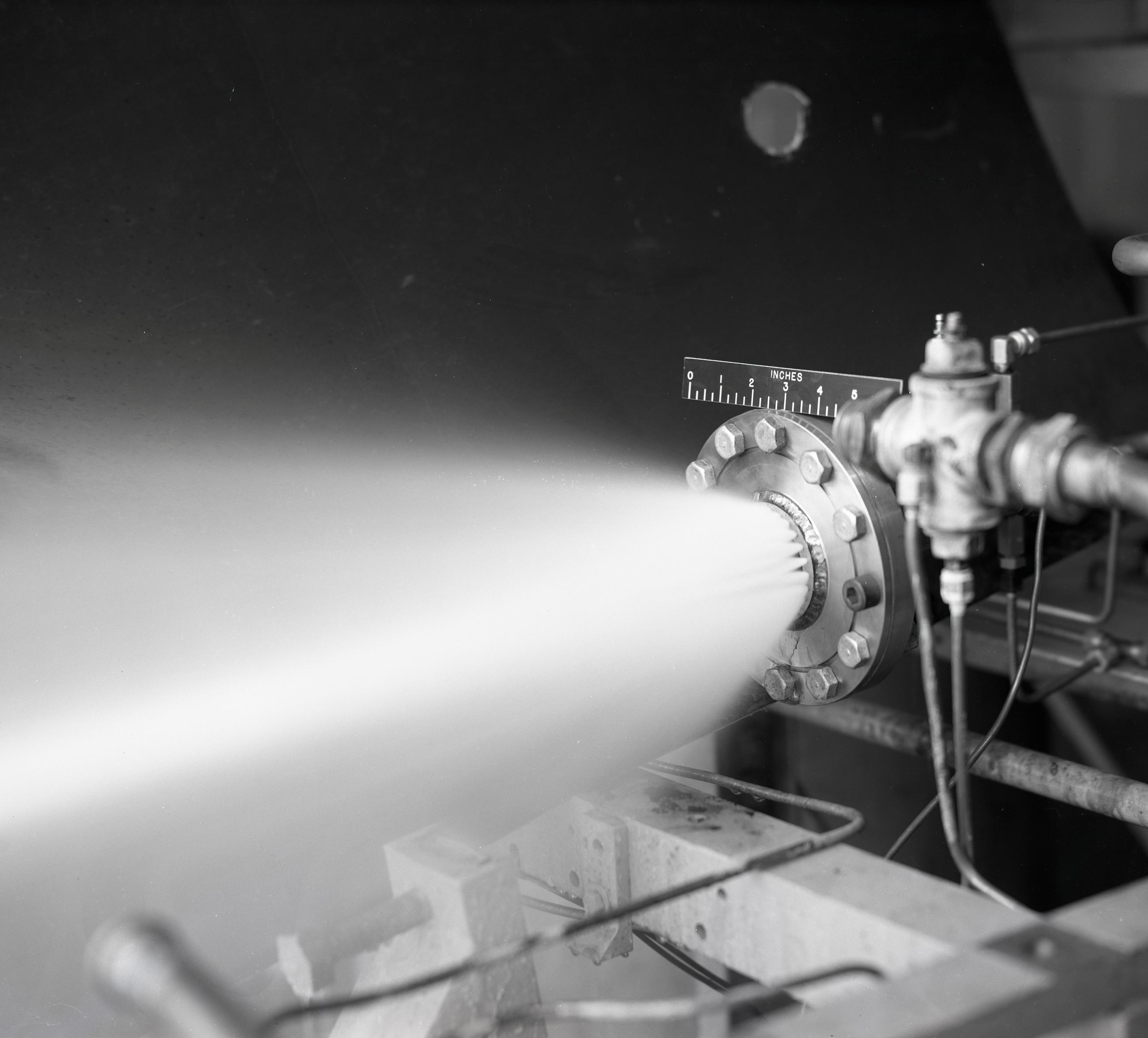 Nozzle spraying fluid.