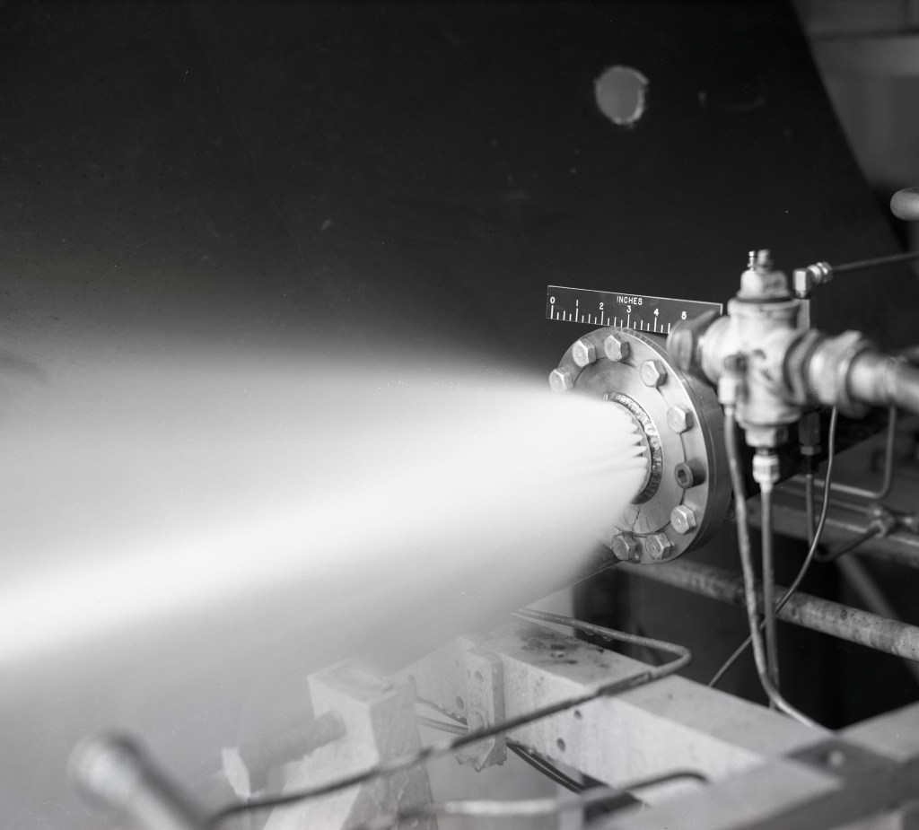 Nozzle spraying fluid.