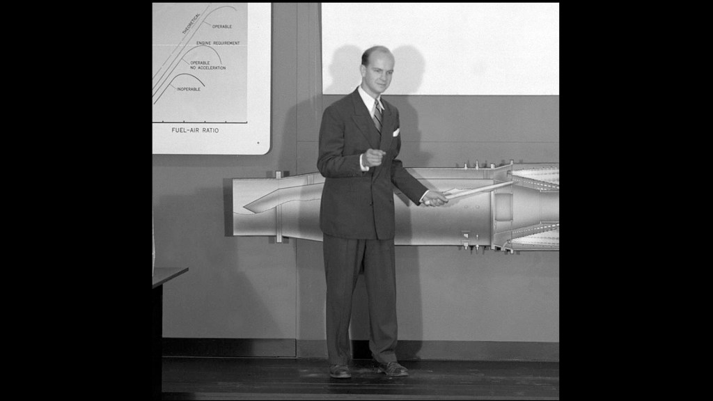 Man standing in front of combustion display.