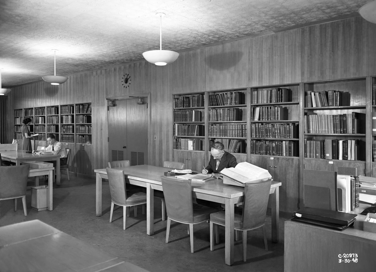 Man sitting at table in library.