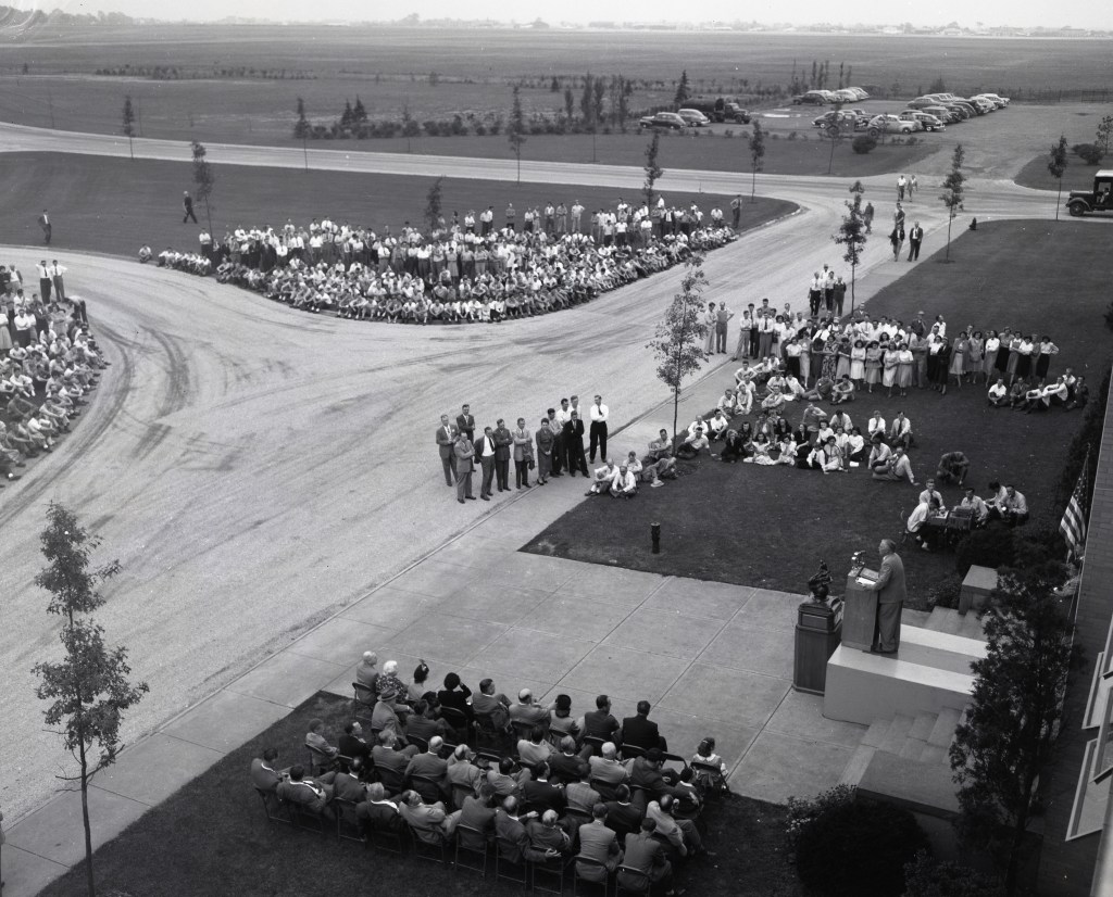 View from above of crowd gathered outside building.