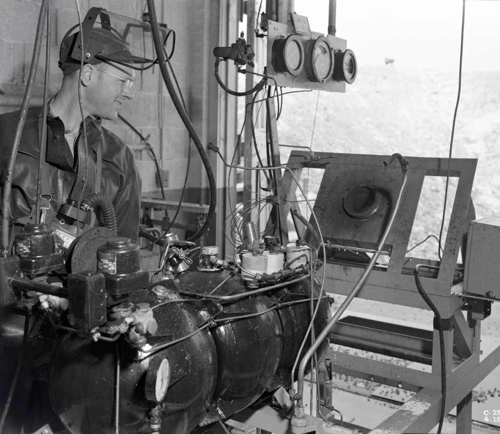 Man looking at test equipment.