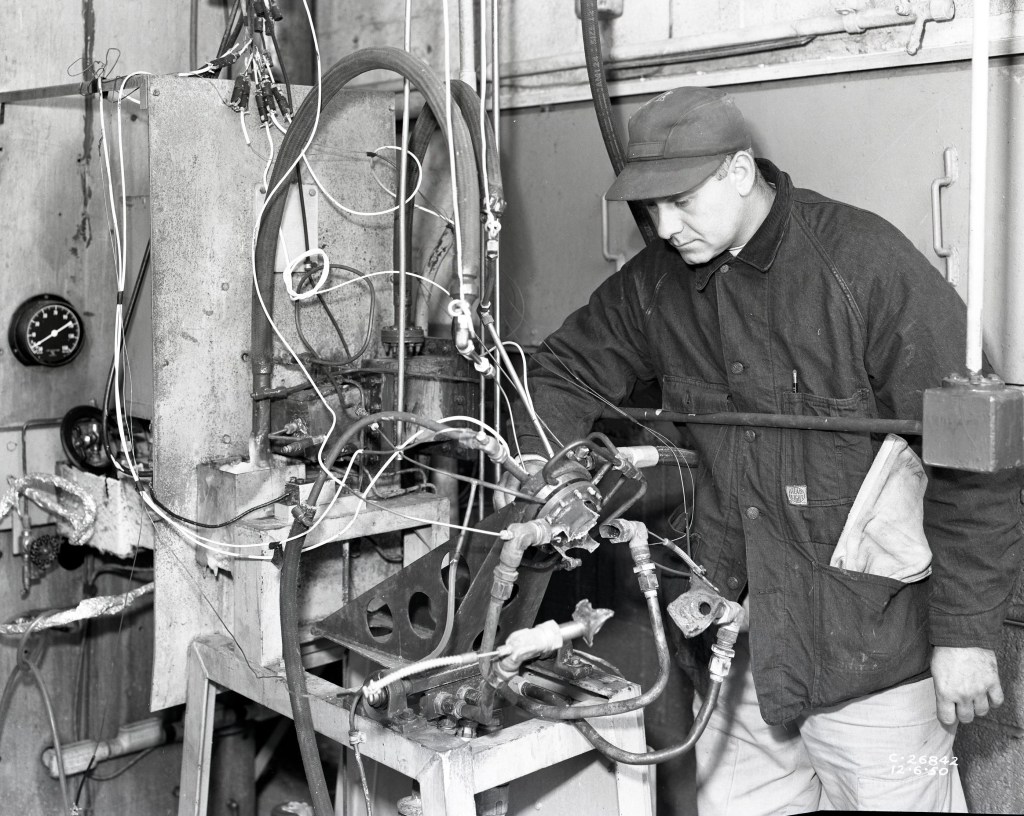 Man examining damaged hardware.
