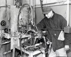 Man examining damaged hardware.