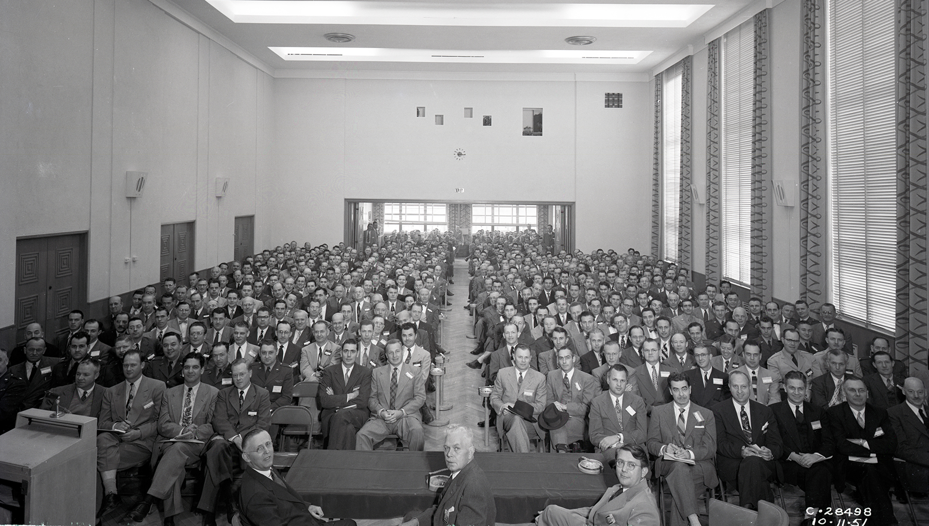 Group seated in auditorium.