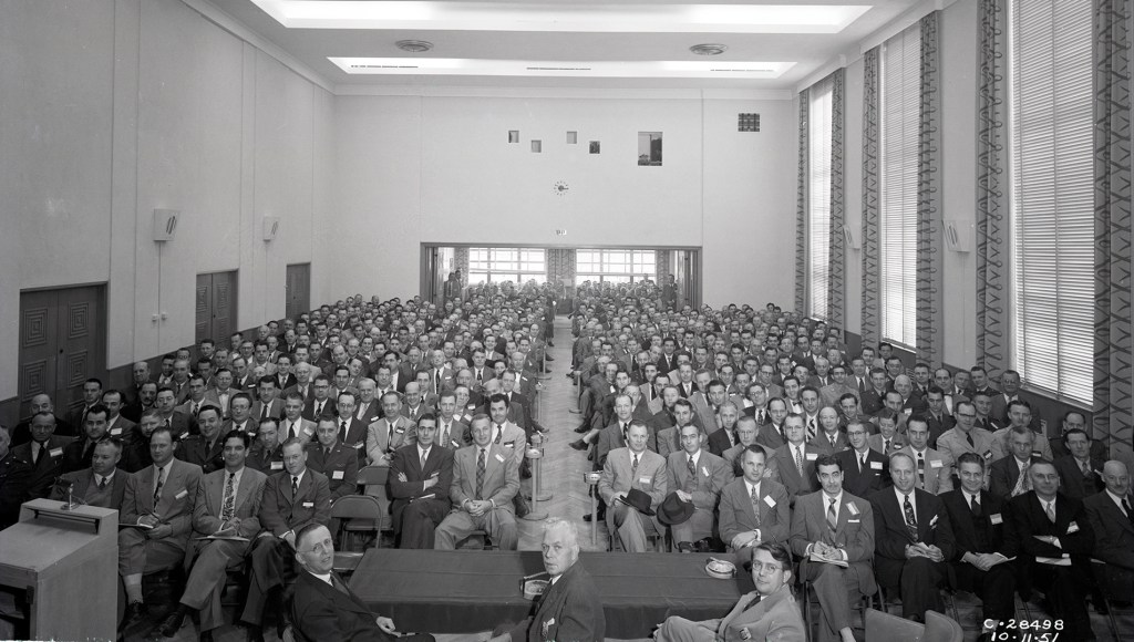 Group seated in auditorium.