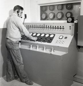 Man at control panel.