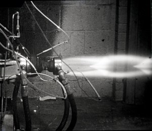 Small rocket firing horizontally.