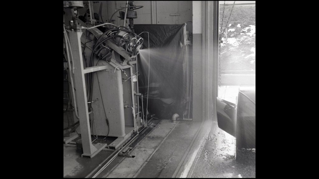 Nozzle spraying fluid.