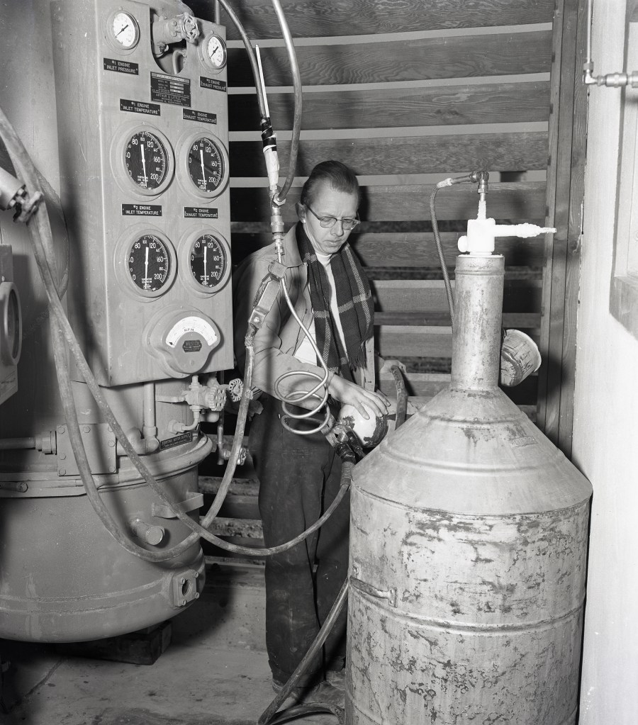 Man with tank equipment.
