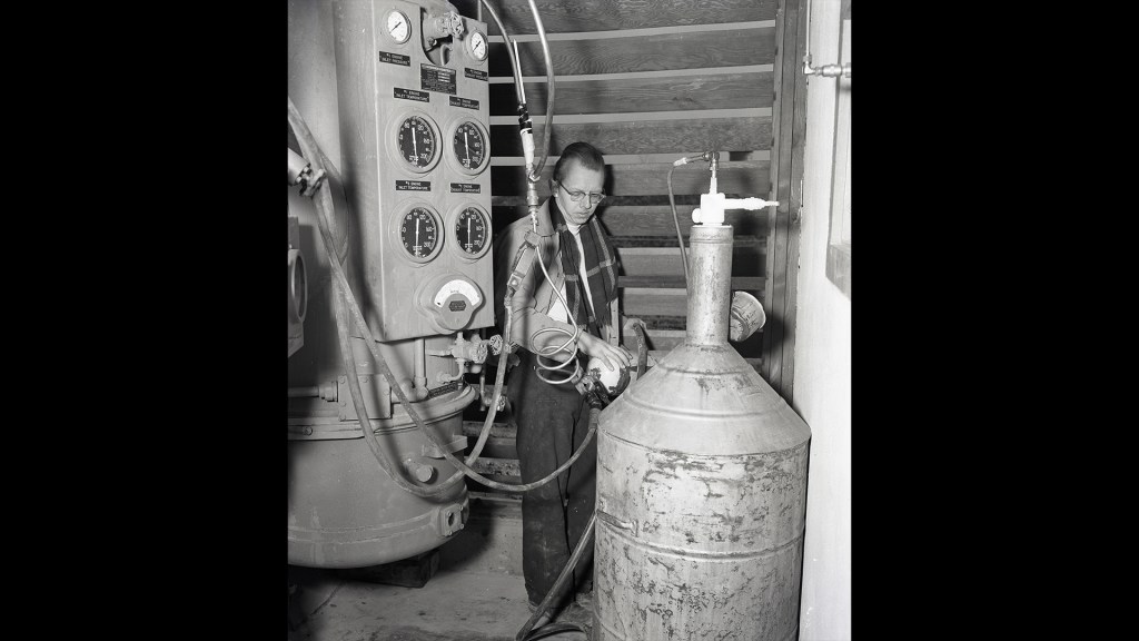 Man with tank equipment.