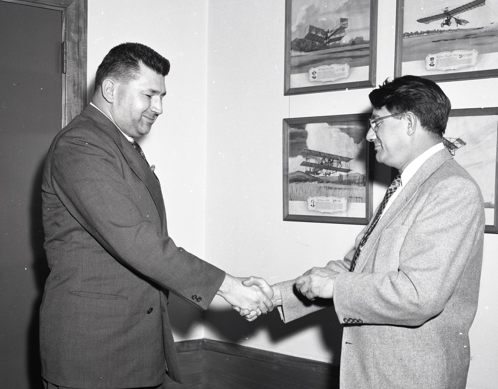 Two men shaking hands.