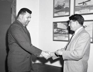 Two men shaking hands.