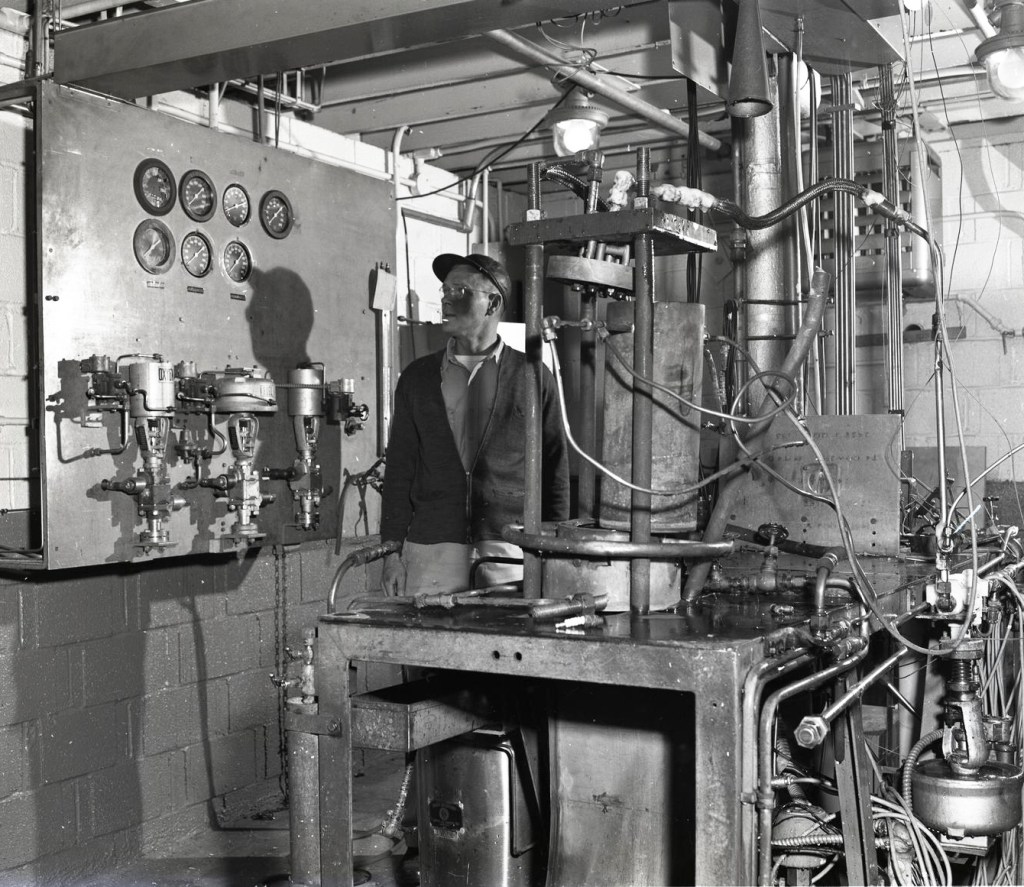 Man with equipment in test cell.