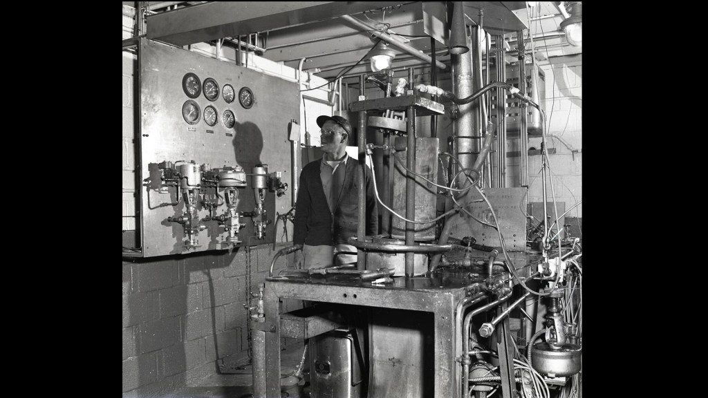 Man with equipment in test cell.