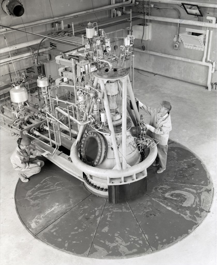 Mechanic working on RETF test stand.