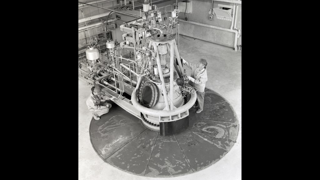 Mechanic working on RETF test stand.