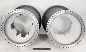 Two tubular thrust chambers with damage.